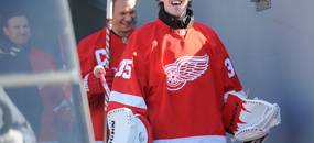 Red Wings goaltender Jimmy Howard smiles as he exits the tunnel and makes his way onto the field at Michigan Stadium for a press conference announcing the 2013 Winter Classic on Thursday afternoon. Melanie Maxwell I AnnArbor.com